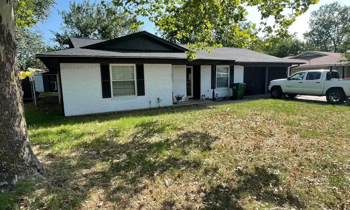 Professional roofing crew working on a residential roof in Lakehills